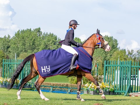 Arianna Kuligowski and IVASCALLE winners of the HY Equestrian RIHS 110m Amateur Championship.